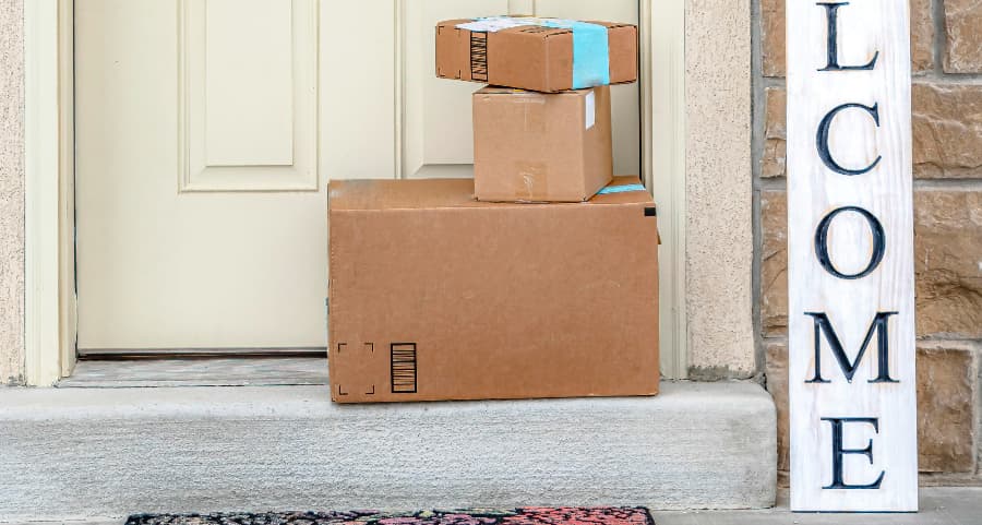 Deliveries on the front porch of a house with a welcome sign in Boise